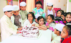 Tiny tots of Greenland Senior Secondary Public School cut a cake on the occasion of Childrens Day in Ludhiana on Saturday.