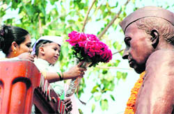 A kid pays tributes to Pandit Jawaharlal Nehru on his birth anniversary in Mumbai on Saturday.