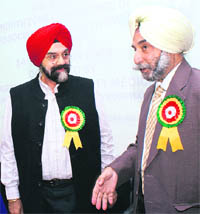 Dr Manmohan Singh (left), president of the Punjab Medical Council, with Dr AS Sekhon, Principal and Dean of the Gian Sagar Group of Institutions at the annual North Zone Indian Association of Preventive and Social Medicine Conference on the college complex at Ram Nagar, Banur, on Saturday.