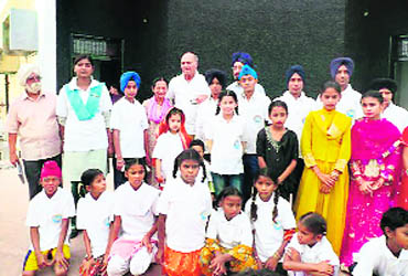 SAF founder Madanjeet Singh with a group of children who performed at a Divali function