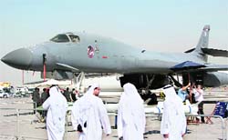 Visitors walk past a US-made B-1B bomber displayed at the Dubai Airshow in the Gulf emirate on Sunday. The airshow opened with more exhibitors and visitors expected than in previous years but amid doubts by analysts that it will see massive orders from oil-rich Gulf monarchies.