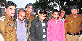 The accused in police custody at Burail police post in Chandigarh on Sunday.