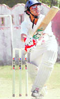 A batsman plays a shot at the Santosh Aggarwal Memorial T20 Cricket Tournament in Dehradun on Sunday. 