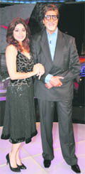 Bollywood actors Amitabh Bachchan (R) and Shamita Shetty pose for a picture on the sets of a television reality show Bigg Boss.