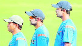 Sachin Tendulkar (L), Gautam Gambhir (C) and Pragyan Ojha during a training session in Ahmedabad on Sunday.