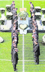 German soccer team members and officials pay their last respects to Robert Enke.