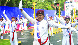 Schoolchildren display road signs for commuters at Delhi Traffic Police Pavilion during the IITF-2009 in New Delhi