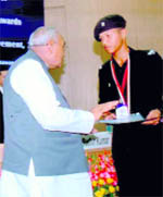 Cadet K Arjun of RIMC receives the Childrens Award for Exceptional Achievement, 2009, from Motilal Vora, MP, in New Delhi on Saturday