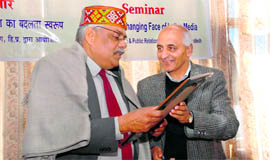 Vibhuti Narayan Rai, Vice-Chancellor of International Mahatma Gandhi Hindi University, Wardha, welcomed by director, information and public relations B.D. Sharma at a seminar in Shimla on Monday.