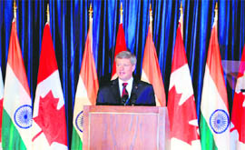 Canadian Prime Minister Stephen Harper talks during an event in Mumbai on Monday. Harper is on a two-day visit to India, calling for stronger and improved ties between the nations.