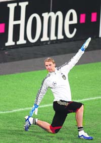 Germany's Manuel Neuer warms up during a training session in Duesseldorf