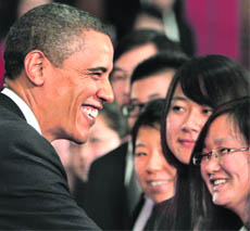 US President Barack Obama greets participants at meeting with future Chinese leaders at the Museum of Science and Technology in Shanghai on Monday.