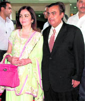 Reliance Industries CMD Mukesh D. Ambani along with his wife Nita arrives for the annual general meeting of RIL, in Mumbai on Tuesday.