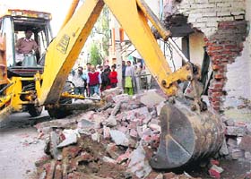Illegal structures being removed at Bapu Dham Colony, Sector 26, Chandigarh
