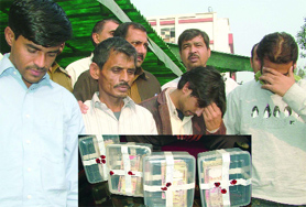 The Delhi police presents four persons who allegedly circulated fake currency in New Delhi on Tuesday.