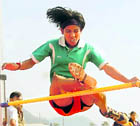 an athlete participates at a high jump event.