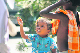 In an age when she should be playing with dolls, this child is begging for alms at Gandhi Nagar in Jammu. 