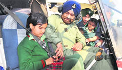 Students of SS Public School with Wing Commander HS Gulati in Ludhiana on Tuesday.