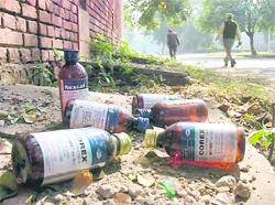 Empty bottles of cough syrup lying near the boundary wall of a private college in Chandigarh.