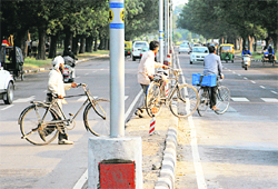 Cyclists violate traffic rules on the road separating Sector 18 and Sector 21 in Chandigarh
