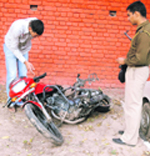 The burnt motorcycle at the police station in Sector 19, Chandigarh,
