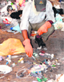 Bio-medical waste lies amid garbage. 