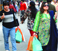 Women carry plastic bags at the India International Trade Fair-2009 in  New Delhi