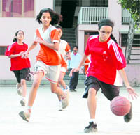 A match in progress at the Inter-Council School Junior Girls Basketball Tournament in Dehradun on Wednesd