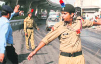NCC cadets manage traffic along with traffic police personnel in Jammu on Wednesday