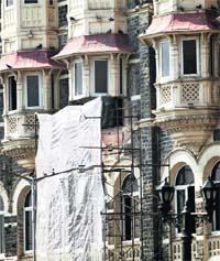 Repair work in progress at one of the balconies on the second floor of the Taj in Mumbai