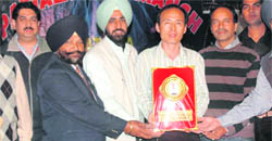 A Korean representative of Kortek Electronics being felicitated at the Karaoke Nite in Patiala 