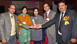 Isha Gawri receiving an award at the national conference on physics in Abohar on Thursday.