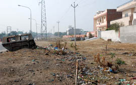 Garbage lies in open in the area meant to serve as green belt in Model Town phase III of Bathinda.