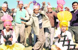 Nepalese farmers enjoy a cultural programme at a school in Mohali on Thursday.
