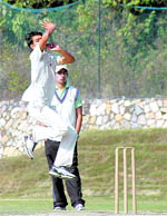 A bowler bowls during the final of the u-17 Boys Cricket Championship in Dehradun on Thursday.