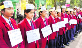 Students participate in a rally over Education Bill in Dehradun on Thursday.