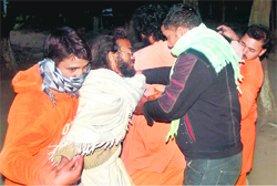 Brahmachari Yajananad being taken away by the police from Matra Sadan.