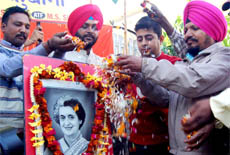 Activists of the Anti-Terrorist Front pay floral tributes to former Prime Minister Indira Gandhi on her birth anniversary in Amritsar on Thursday.