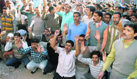 SRTC employees hold a demonstration as part of their unusual protest in Jammu on Thursday.