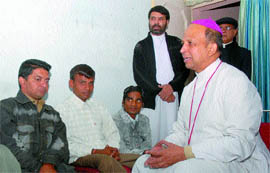 Bishop of Jalandhar Anil Jose Couto interacts with polio affected youths at the office of Roshni in Jalandhar.