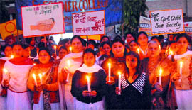 Students of St. Soldier Group of Institutions take out a candle march against female foeticide in Jalandhar on Thursday.