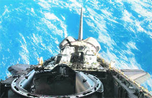 This image provided by NASA shows a partial view of Space Shuttle Atlantis' payload bay, vertical stabiliser, orbital manoeuvring system pods and docking mechanism. Atlantis arrived at the International Space Station on Wednesday for a weeklong stay.