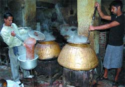 Cooks prepare food at Kesar Da Dhaba in Amritsar.