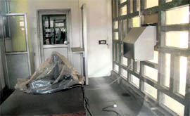A wrapped-up computer, meant for the RFID system, and a drop-box, attached to windowpanes, at the Panjab Universitys AC Joshi library in Chandigarh.