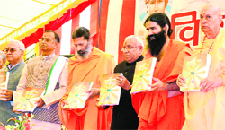 Swami Ramdev and other dignitaries release a research book on Vedas in Rishikesh 