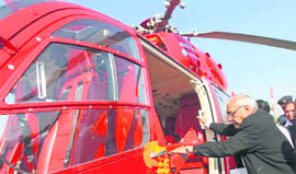  Chief Minister Bhupinder Singh Hooda  boards his new red chopper in Chandigarh on Friday.