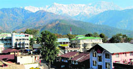 Snow-clad Dhauladhars overlooking lush green Kangra valley on a sunny Friday