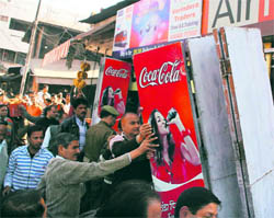 JDA employees remove encroachments in the Bus Stand area in Jammu on Friday
