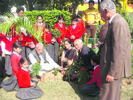 Students plant saplings during a plantation drive at St Bawra Public High School in Ludhiana on Friday.