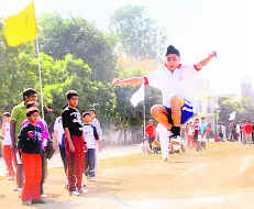 A student takes part in long jump event during the annual athletics meet at BCM Arya Model Senior Secondary School, Shastri Nagar, Ludhiana, on Friday. 